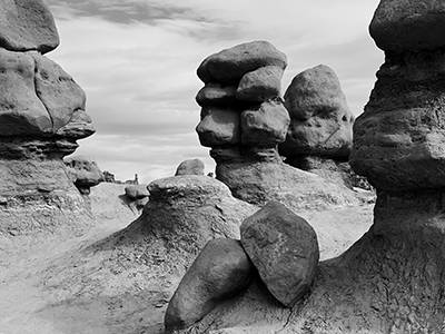 Black-and-white close-up photograph of eroded sandstone hoodoo formations at Goblin Valley State Park.