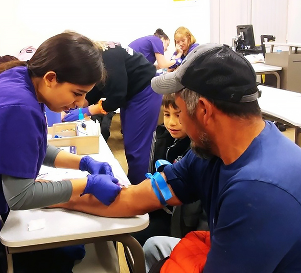 phlebotomy student drawing blood