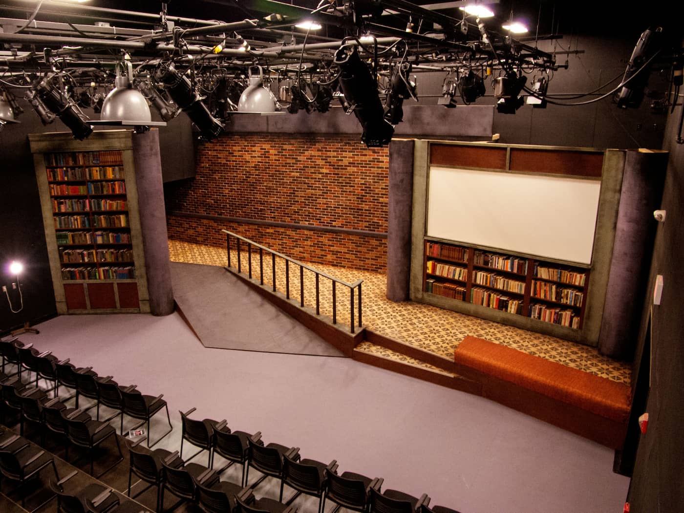 An aerial shot of chairs and a stage set up in the Black Box Theatre