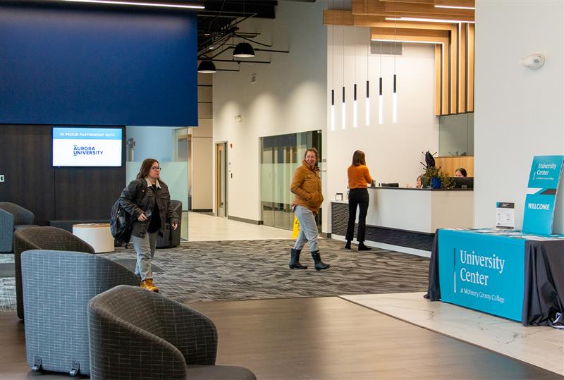 two students walk into the foyer of MCC's Catalyst Campus