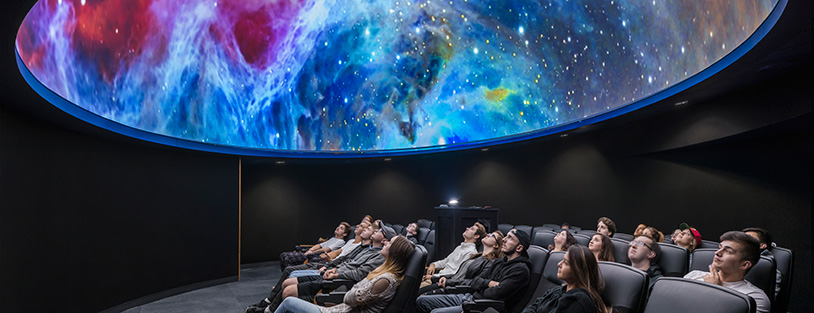 photo inside our planetarium with a vibrant starry sky