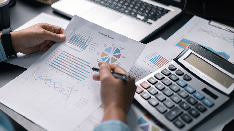 accountant with journal and calculator