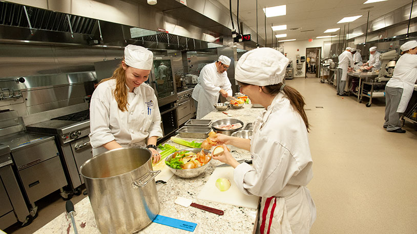 culinary students preparing vegetables