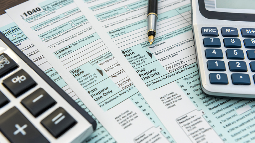 accountant with journal and calculator