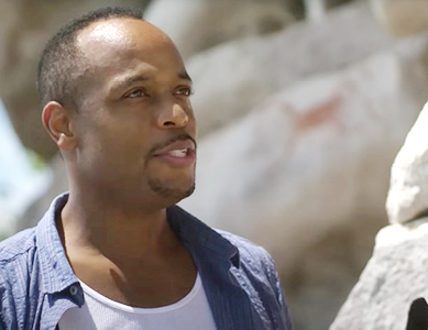 Dr. Christopher Davis onsite looking at rocks