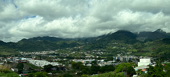 A distant city at the base of the mountains in Costa Rica